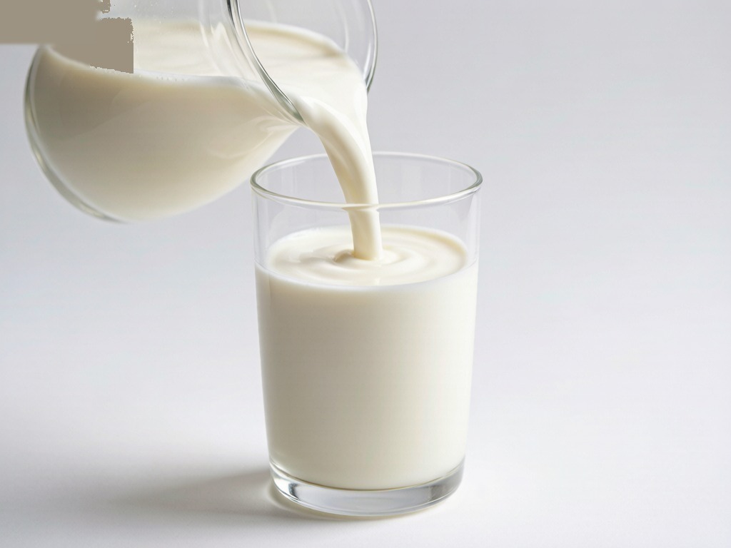 Fresh creamy whole milk being poured slowly, white texture, soft studio lighting, clean minimal background